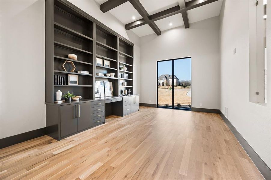 Office featuring beamed, coffered ceiling and a built-in desk