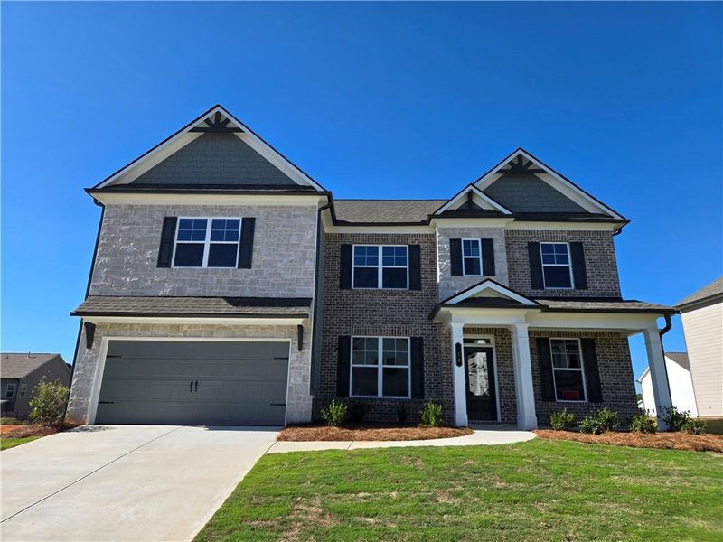 Front exterior of a new home in Enclave at Logan Point, Loganville, GA, highlighting curb appeal (Image 19).