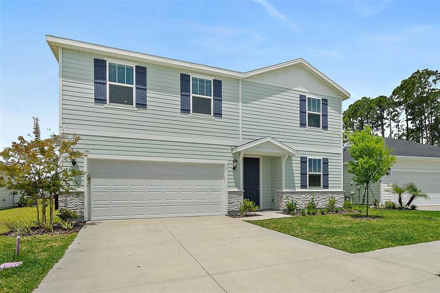 Front exterior of a new home in , Palm Coast, FL, highlighting curb appeal (Image 30). Front exterior of a new home in , Palm Coast, FL, highlighting curb appeal (Image 30).