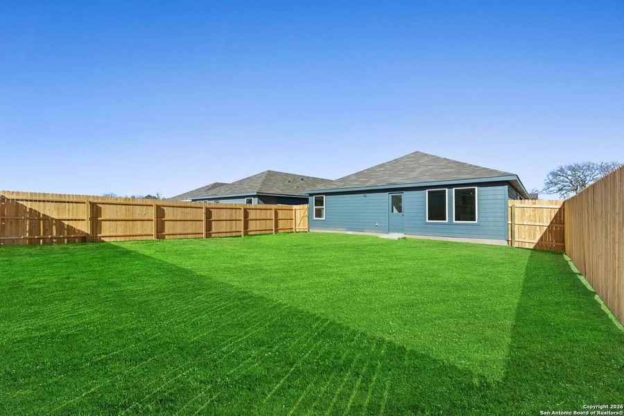 Exterior details and patio area of a home in Friendship Oaks: Watermill Collection, Fredericksburg (Image 2).