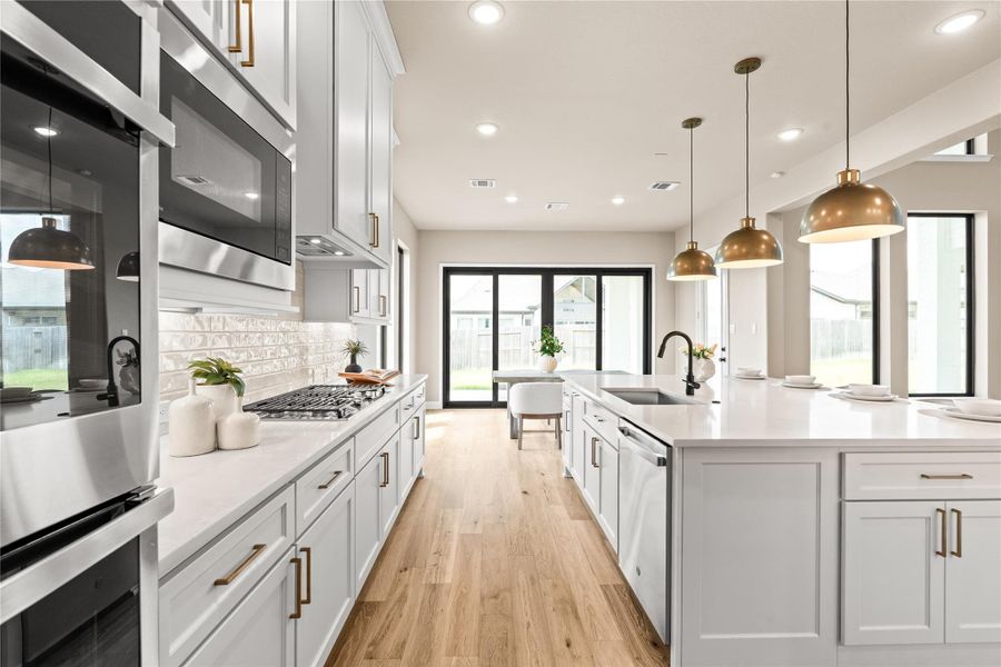 You will love whipping up new recipes and entertaining in this dream kitchen. Pendant lights overhead, ideal for traffic flow, and room to cook and talk at the same time. *Virtually Staged*
