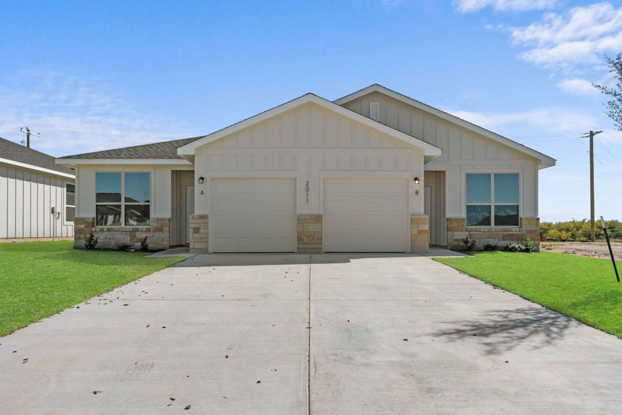 Front exterior of a new home in Ridge at Knob Creek Duplexes, Temple, TX, highlighting curb appeal (Image 1). Front exterior of a new home in Ridge at Knob Creek Duplexes, Temple, TX, highlighting curb appeal (Image 1).