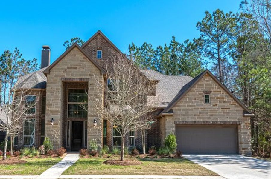 Representative exterior photo of a completed home built from the 4195 by Ravenna Homes in Artavia 70′, Conroe, TX (Image 2). Representative exterior photo of a completed home built from the 4195 by Ravenna Homes in Artavia 70′, Conroe, TX (Image 2).