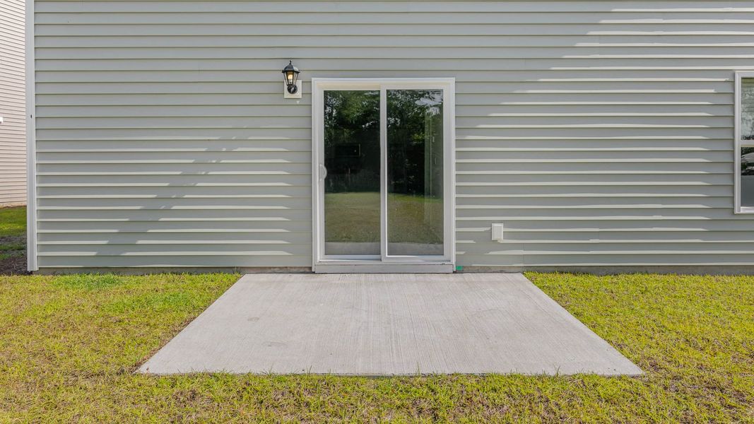 Representative exterior photo of a completed home built from the WREN by D.R. Horton in Cedar Hill Landing, Navassa, NC (Image 19).