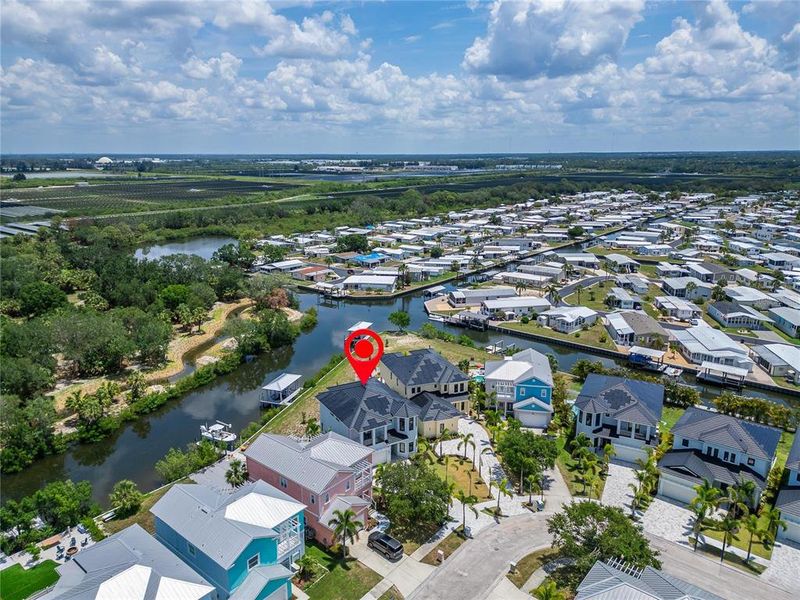 Front exterior of a new home in , Apollo Beach, FL, highlighting curb appeal (Image 1).