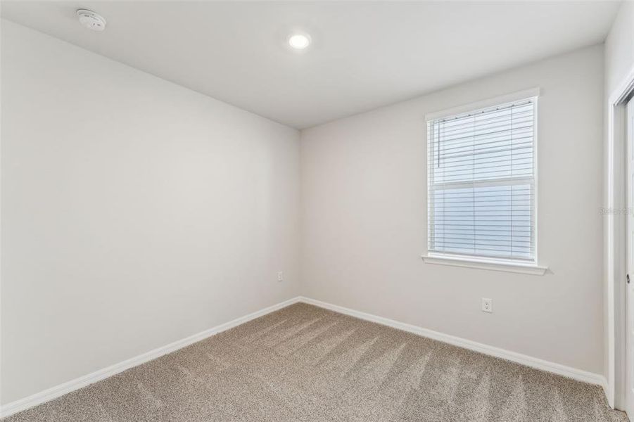 Spacious, unfurnished interior of a new home in Crescent Lakes - Premier Series, Punta Gorda (Image 19).