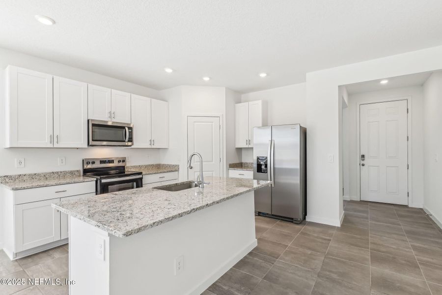 Furnished interior view inside a new home in Lakes at Bella Lago - Signature Series, Green Cove Springs (Image 4). Furnished interior view inside a new home in Lakes at Bella Lago - Signature Series, Green Cove Springs (Image 4).