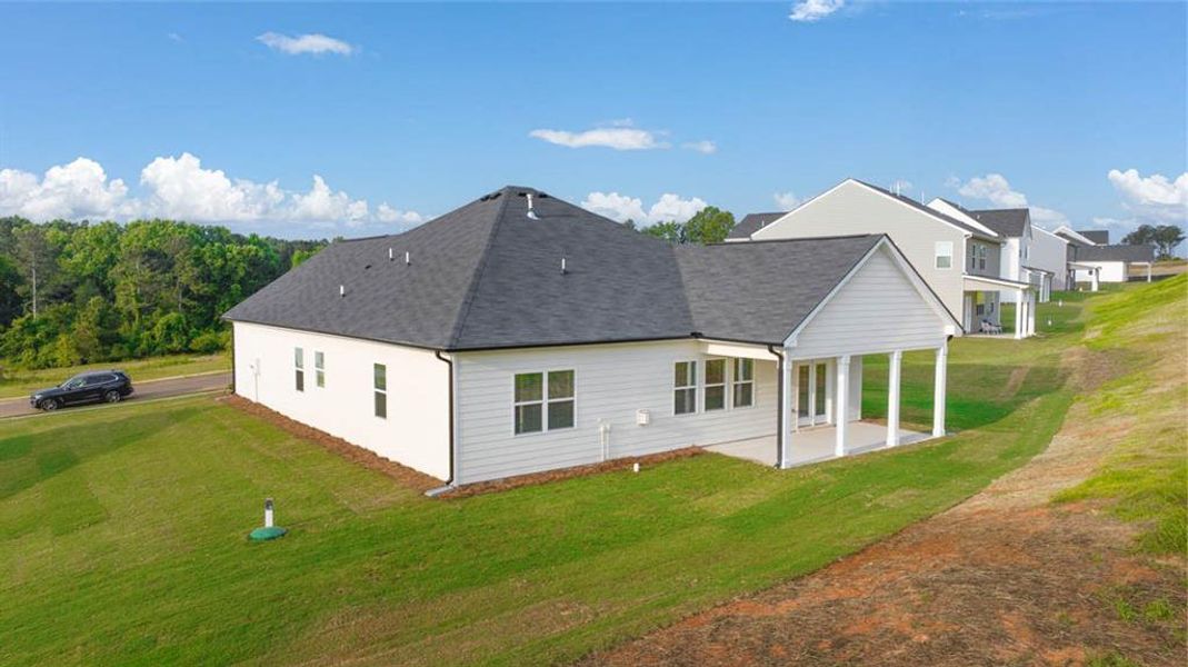 Front exterior of a new home in Bridle Creek, Locust Grove, GA, highlighting curb appeal (Image 17).