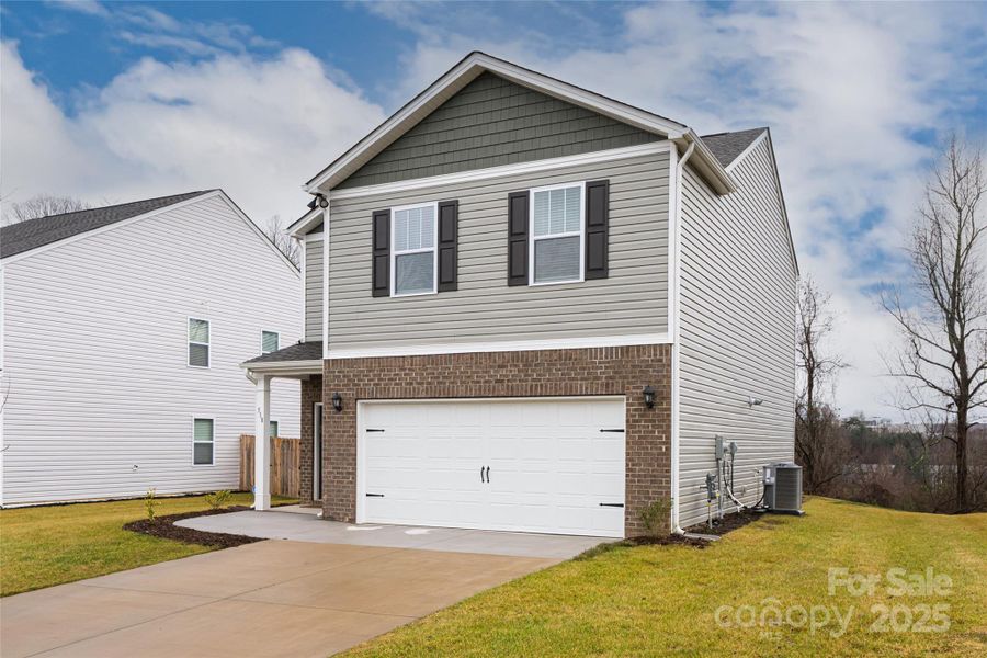 Front exterior of a new home in , Arden, NC, highlighting curb appeal (Image 1). Front exterior of a new home in , Arden, NC, highlighting curb appeal (Image 1).