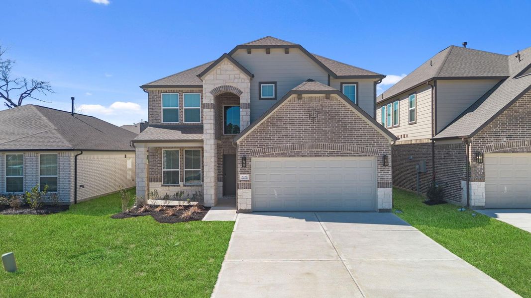 Front exterior of a new home in Barton Creek Ranch, Conroe, TX, highlighting curb appeal (Image 18).