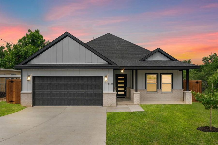 View of front of house featuring brick siding, roof with shingles, a garage, and driveway View of front of house featuring brick siding, roof with shingles, a garage, and driveway