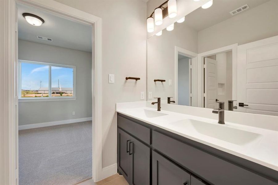 Full bathroom with double vanity and light colored carpet Full bathroom with double vanity and light colored carpet