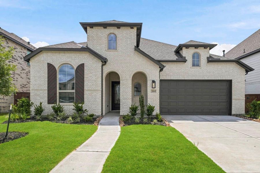Spanish Colonial elevation with front porch. Spanish Colonial elevation with front porch.