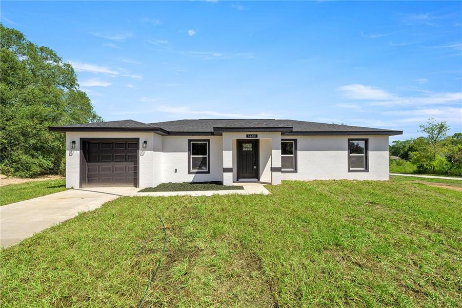 Front exterior of a new home in , Ocala, FL, highlighting curb appeal (Image 1).