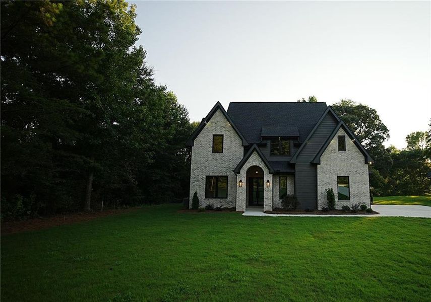 Front exterior of a new home in , Flowery Branch, GA, highlighting curb appeal (Image 26).