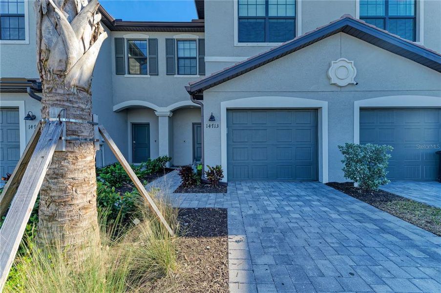 Front exterior of a new home in , Bradenton, FL, highlighting curb appeal (Image 21).