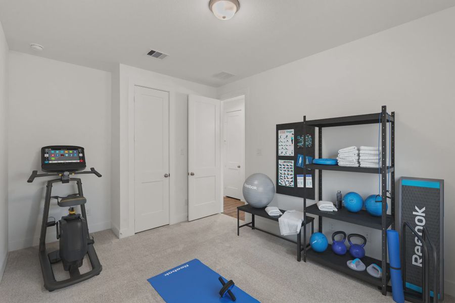 Representative furnished interior of a home built from the Mirabelle by Chesmar Homes in Artavia, Conroe (Image 7).