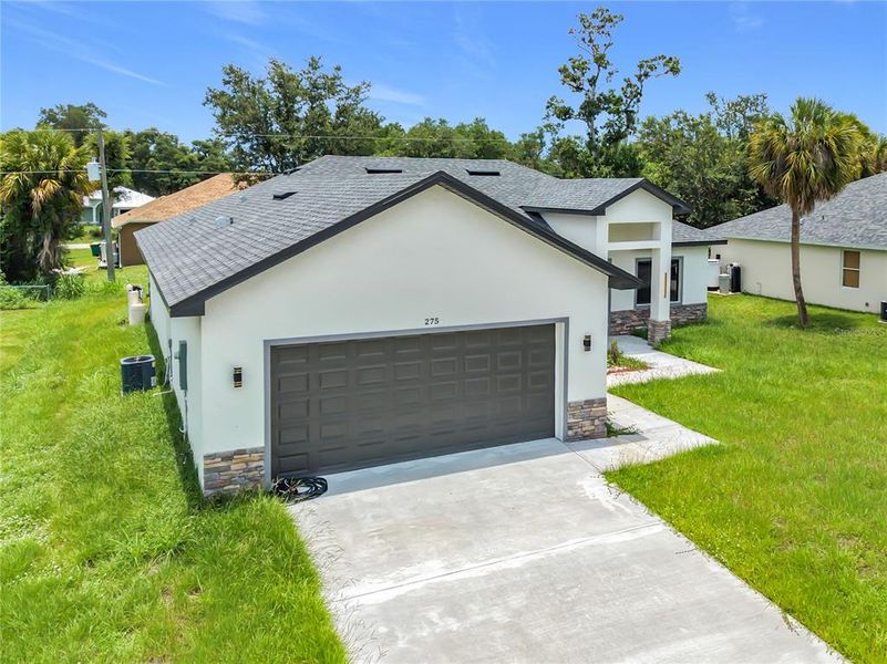 Front exterior of a new home in , Port Charlotte, FL, highlighting curb appeal (Image 30). Front exterior of a new home in , Port Charlotte, FL, highlighting curb appeal (Image 30).