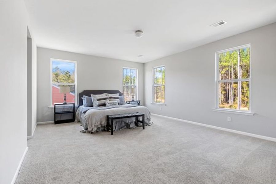 Representative furnished interior of a home built from the Winslow P by True Homes in Homecoming, Ravenel (Image 11).