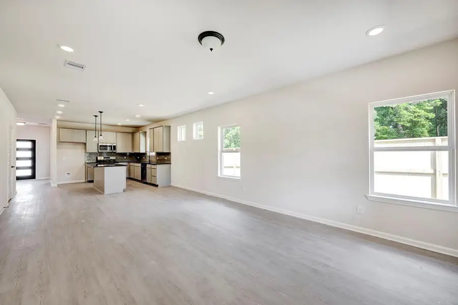 The Davenport II- Family Room into Kitchen. Home under construction. Sample floor plan photo used for illustrative purposes only. Upgrades, selections options, windows and colors may vary. The Davenport II- Family Room into Kitchen. Home under construction. Sample floor plan photo used for illustrative purposes only. Upgrades, selections options, windows and colors may vary.