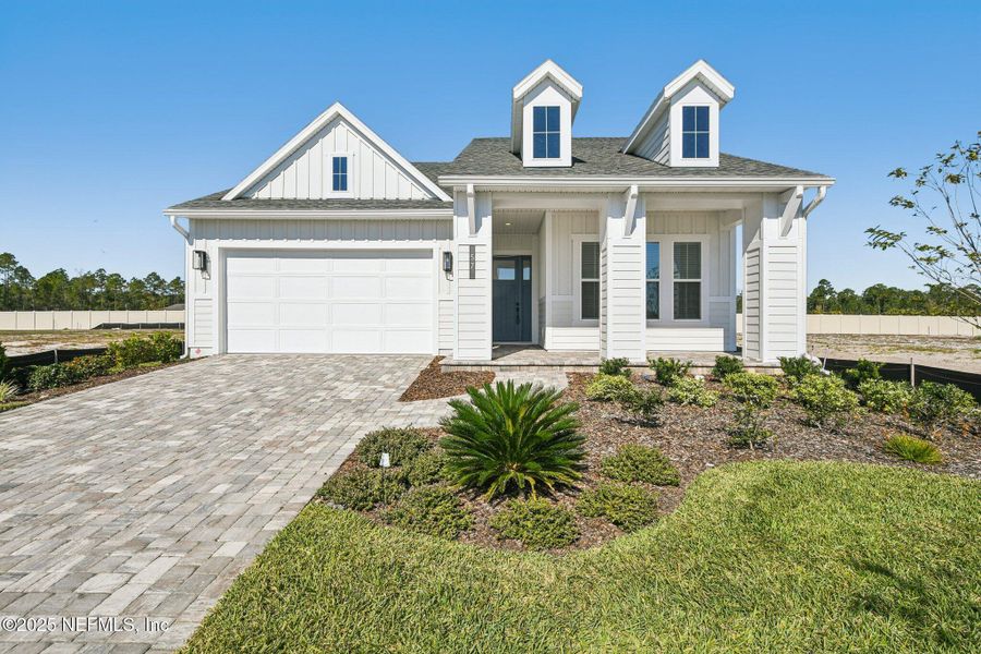 Front exterior of a new home in Seabrook Village II, Ponte Vedra, FL, highlighting curb appeal (Image 30). Front exterior of a new home in Seabrook Village II, Ponte Vedra, FL, highlighting curb appeal (Image 30).