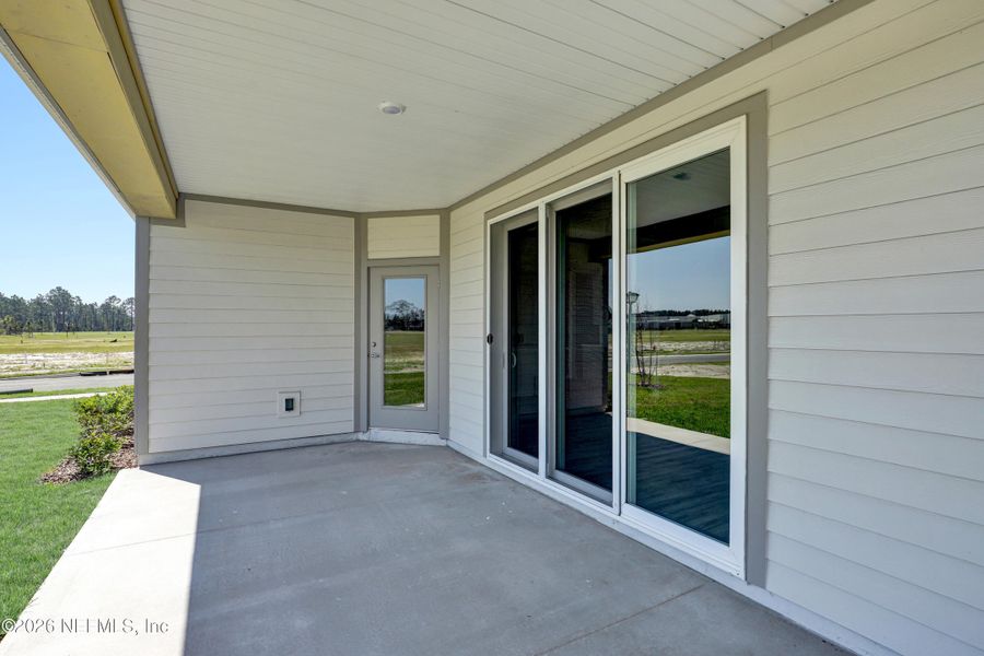 Exterior details and patio area of a home in New 55+ Active Adult Community in St. Augustine, St. Augustine (Image 15).