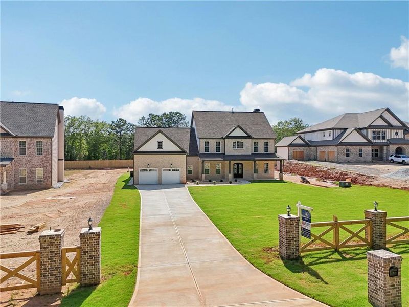 Front exterior of a new home in , Lilburn, GA, highlighting curb appeal (Image 33).