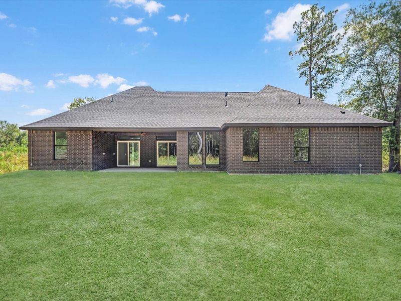 A view from your oasis! This lot has been partially cleared for the option to add a pool, playground or just enjoying the lawn. You still have plenty of privacy.