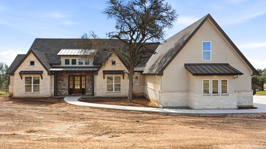 Front exterior of a new home in , New Braunfels, TX, highlighting curb appeal (Image 2). Front exterior of a new home in , New Braunfels, TX, highlighting curb appeal (Image 2).