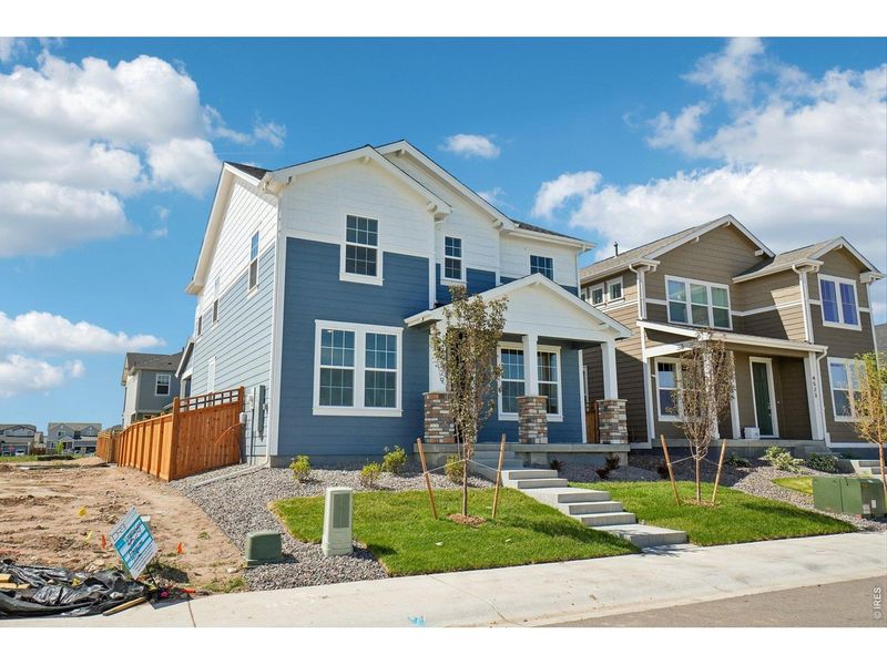 Front exterior of a new home in Timnath Lakes, Timnath, CO, highlighting curb appeal (Image 1). Front exterior of a new home in Timnath Lakes, Timnath, CO, highlighting curb appeal (Image 1).