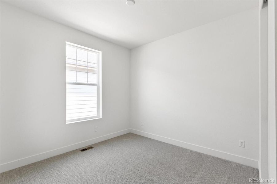 Spacious, unfurnished interior of a new home in Terrain Oak Valley, Castle Rock (Image 22).