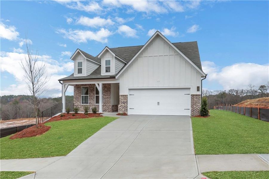Front exterior of a new home in Cambridge at Steels Bridge, Canton, GA, highlighting curb appeal (Image 25). Front exterior of a new home in Cambridge at Steels Bridge, Canton, GA, highlighting curb appeal (Image 25).
