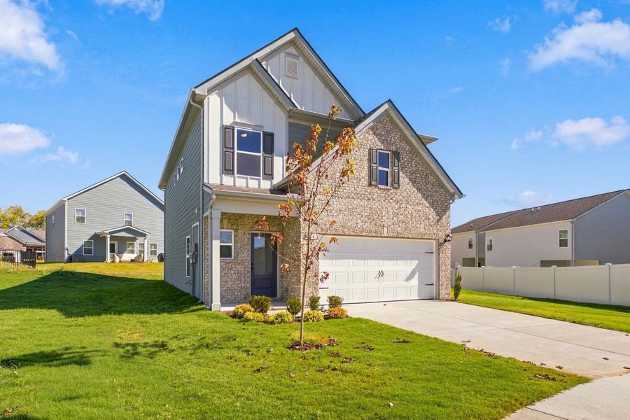Front exterior of a new home in Winston Place, Gallatin, TN, highlighting curb appeal (Image 2). Front exterior of a new home in Winston Place, Gallatin, TN, highlighting curb appeal (Image 2).