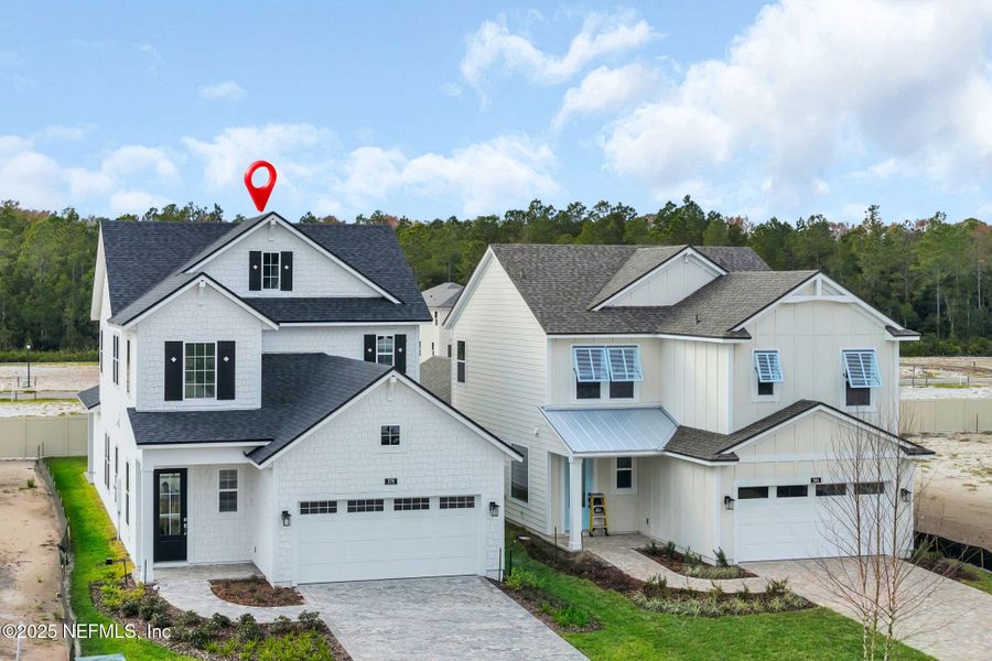 Front exterior of a new home in Seabrook Village at Seabrook, Ponte Vedra, FL, highlighting curb appeal (Image 26).