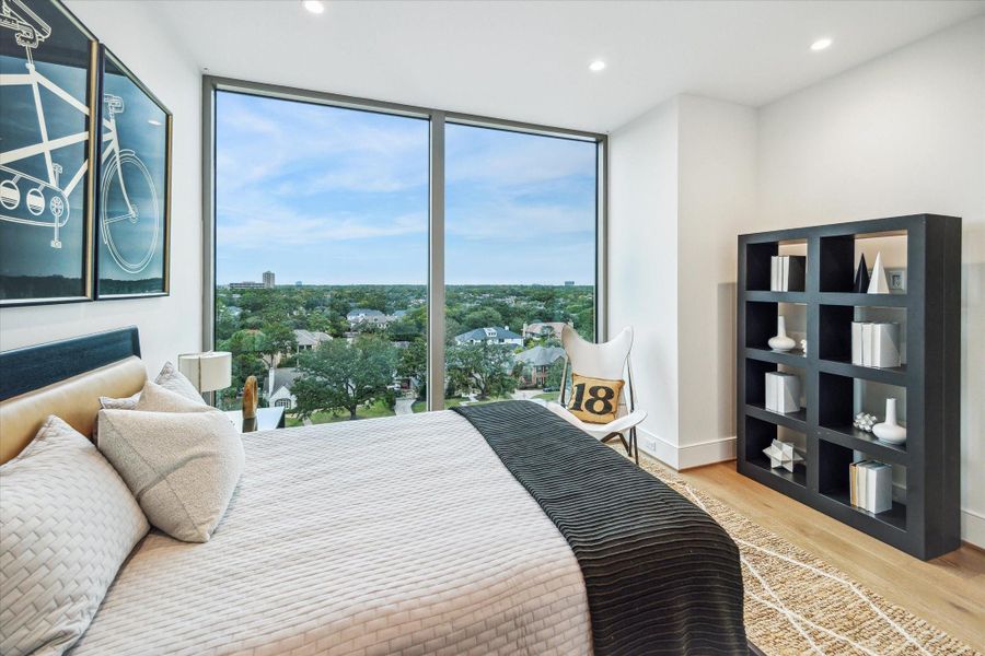 En-suite bedroom featuring floor-to-ceiling windows. Photos are of a similar unit with the same floor plan En-suite bedroom featuring floor-to-ceiling windows. Photos are of a similar unit with the same floor plan