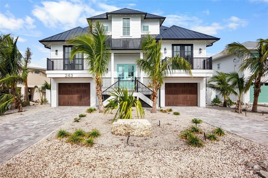 Front exterior of a new home in , Holmes Beach, FL, highlighting curb appeal (Image 21).