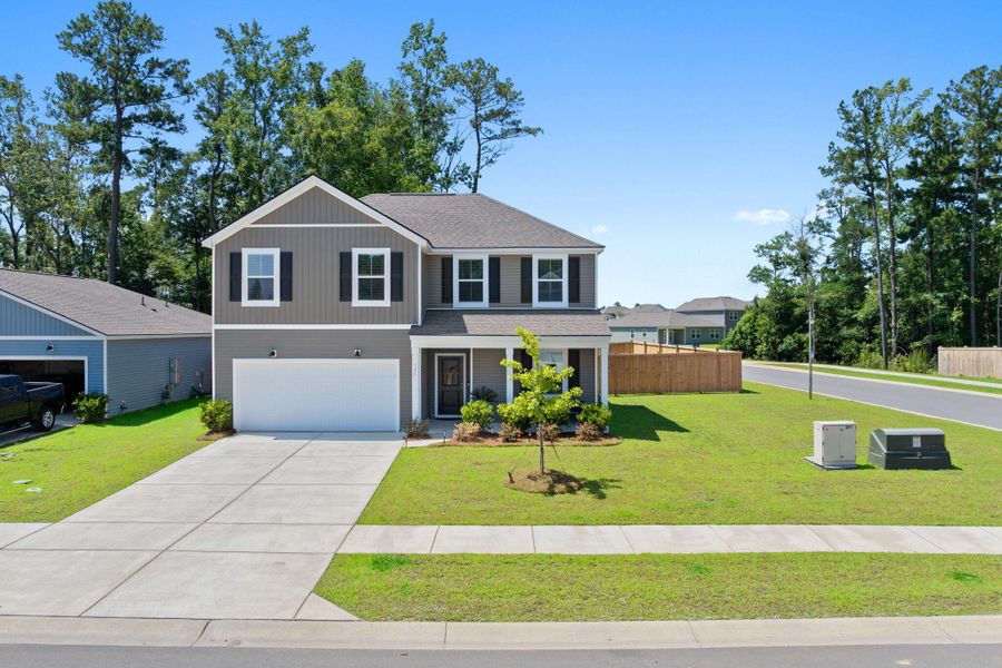 Front exterior of a new home in , Summerville, SC, highlighting curb appeal (Image 1). Front exterior of a new home in , Summerville, SC, highlighting curb appeal (Image 1).