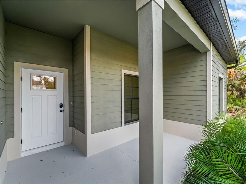 Exterior details and patio area of a home in , North Port (Image 34).