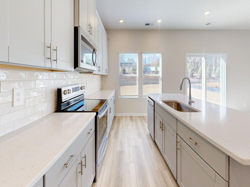 The sleek and functional kitchen makes meal preparing a breeze.