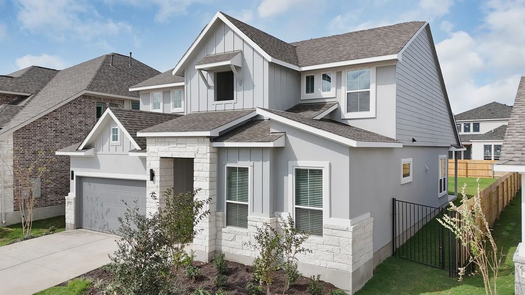 Front exterior of a new home in Santa Rita Ranch, Liberty Hill, TX, highlighting curb appeal (Image 15).