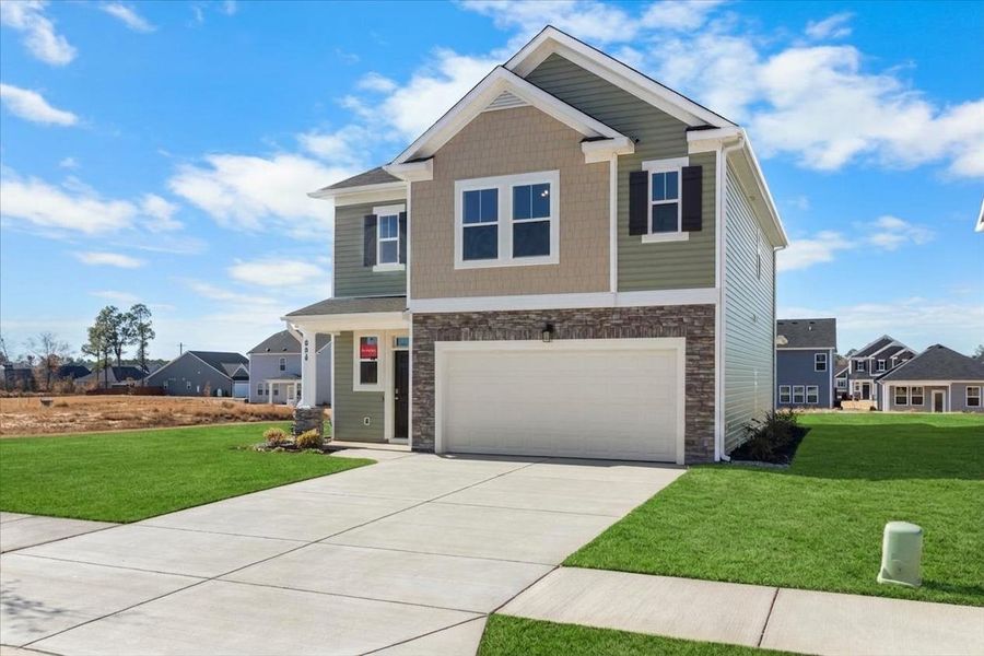 Front exterior of a new home in Windsor, North Augusta, SC, highlighting curb appeal (Image 21). Front exterior of a new home in Windsor, North Augusta, SC, highlighting curb appeal (Image 21).
