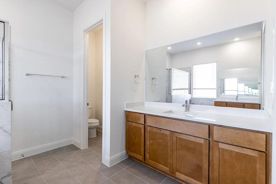 Furnished interior view inside a new home in The Colony - 50', Bastrop (Image 9).