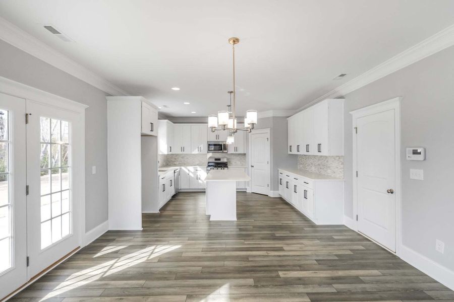 Representative unfurnished interior of a home built from the Drayton by Caviness & Cates Communities in Bartlett Manor, Youngsville (Image 187).