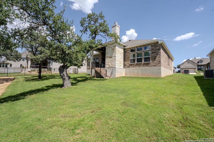 Front exterior of a new home in Arbors at Fair Oaks, Fair Oaks Ranch, TX, highlighting curb appeal (Image 22). Front exterior of a new home in Arbors at Fair Oaks, Fair Oaks Ranch, TX, highlighting curb appeal (Image 22).
