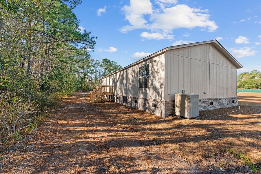 Exterior details and patio area of a home in , Moncks Corner (Image 2). Exterior details and patio area of a home in , Moncks Corner (Image 2).