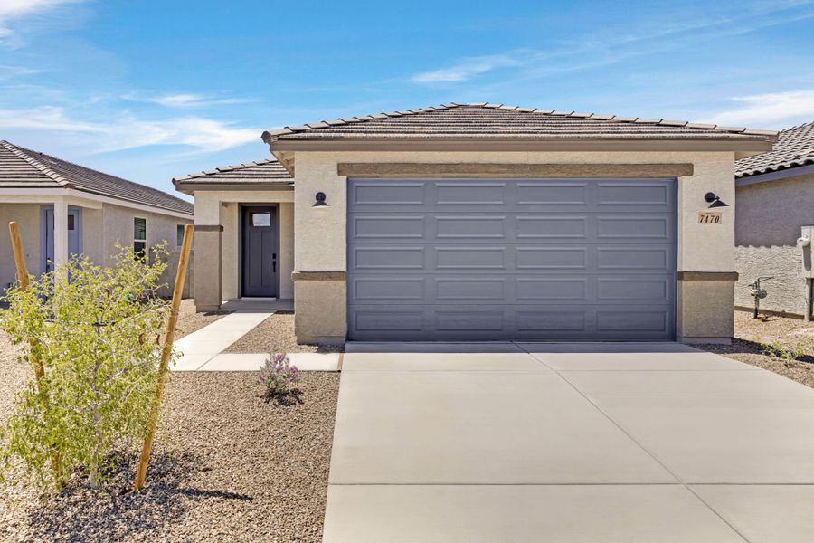 Front exterior of a new home in Blackhawk, Tucson, AZ, highlighting curb appeal (Image 1). Front exterior of a new home in Blackhawk, Tucson, AZ, highlighting curb appeal (Image 1).