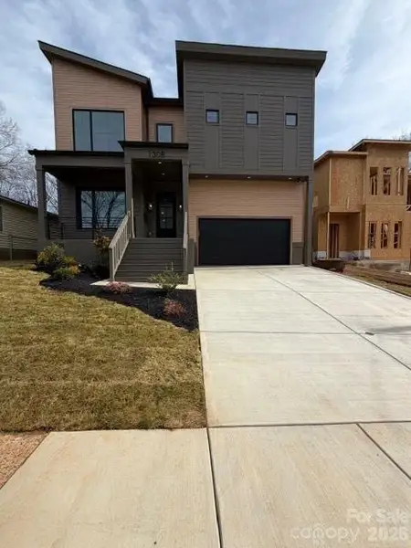 Front exterior of a new home in , Charlotte, NC, highlighting curb appeal (Image 1). Front exterior of a new home in , Charlotte, NC, highlighting curb appeal (Image 1).