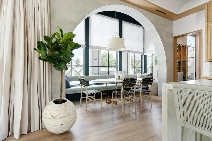 Cozy breakfast nook with built-in seating and large windows overlooking the backyard.*Images depict previously completed homes by Roberson Building Group and are intended solely to showcase builder quality and craftsmanship.