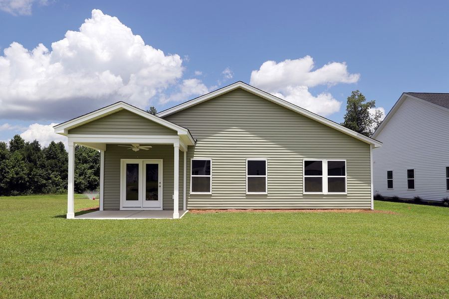 Front exterior of a new home in Jordan Grove, Conway, SC, highlighting curb appeal (Image 22). Front exterior of a new home in Jordan Grove, Conway, SC, highlighting curb appeal (Image 22).