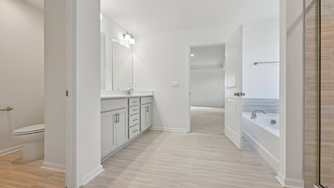 Representative furnished interior of a home built from the Wylie by D.R. Horton in Eagle Creek, Fuquay Varina (Image 12).